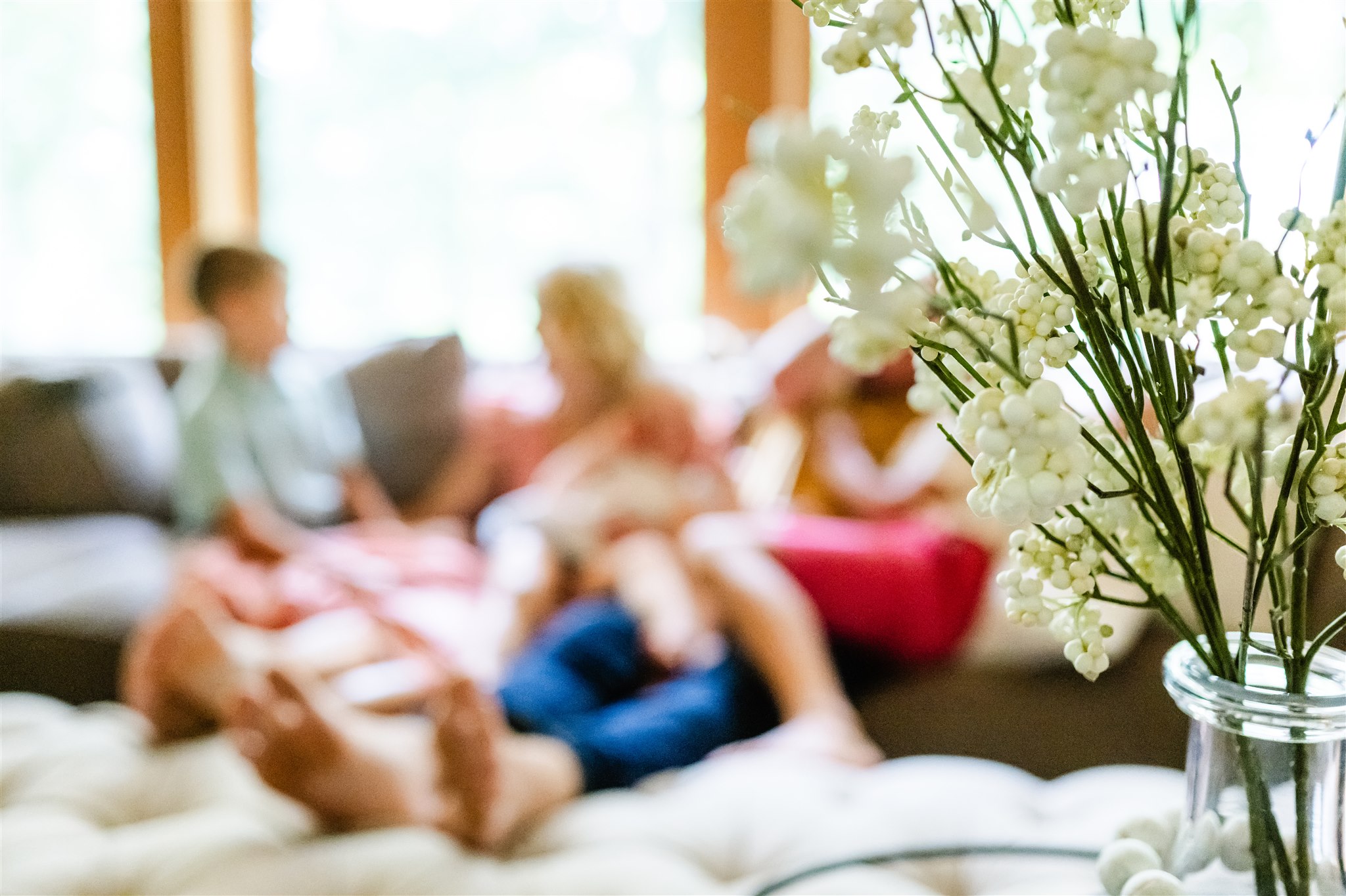 Details of white flowers in a vase in a family living room